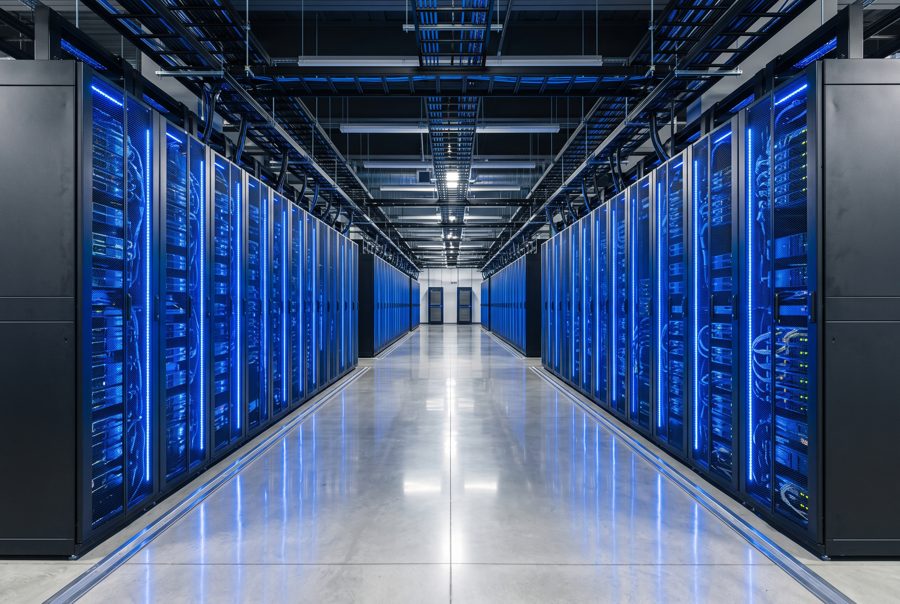 Modern data center corridor with blue lit server racks