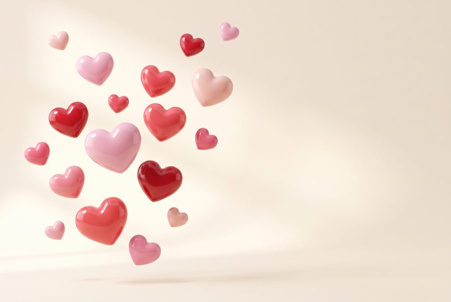 Glossy pastel pink and red 3D hearts floating on cream, Valentine background